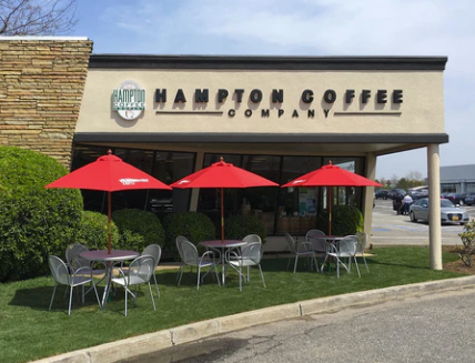 Hampton Coffee Company storefront with outdoor seating, representing one of the Hamptons’ top local coffee roasters.